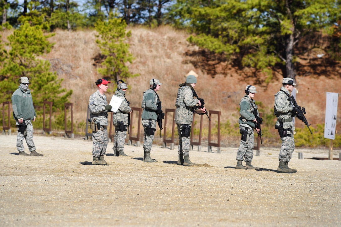 New Jersey Air National Guardsmen wait for their range instructor to signal them to begin firing at Joint Base McGuire-Dix-Lakehurst, New Jersey, Feb. 26, 2017. The airmen are assigned to the New Jersey Air National Guard’s 108th Security Forces Squadron, and are required to qualify annually on both the M4 carbine and M9 pistol. New Jersey Air National Guard photo by Senior Airman Julia Santiago