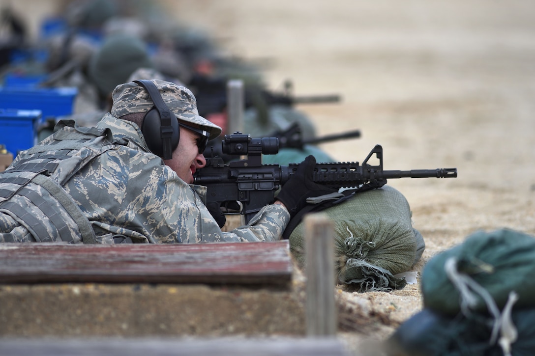 New Jersey Air National Guard Airman 1st Class Juan Rosado uses his M4 rifle scope to align his target before firing during range qualification at Joint Base McGuire-Dix-Lakehurst, New Jersey, Feb. 26, 2017. Rosado is assigned to the 108th Security Forces Squadron. New Jersey Air National Guard photo by Senior Airman Julia Santiago