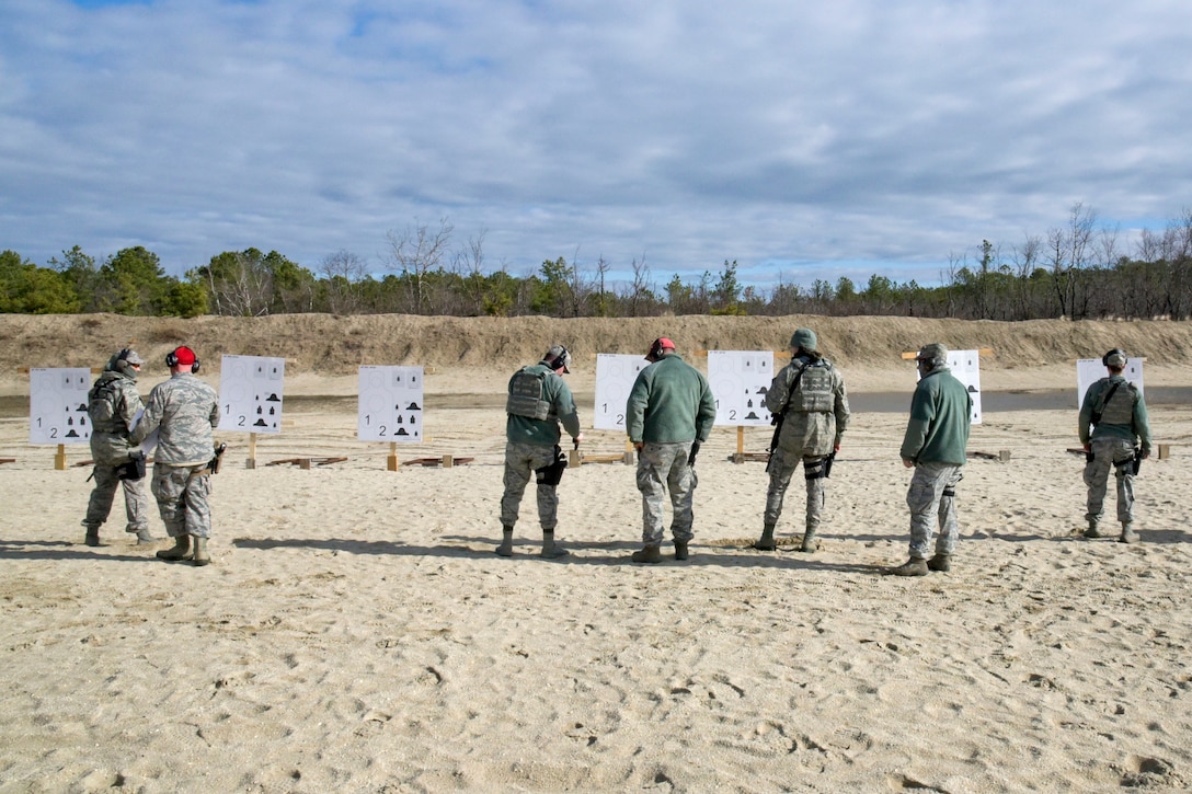 New Jersey Air National Guardsmen wait as the range safety officer ensures it is safe to review their targets during range qualification at Joint Base McGuire-Dix-Lakehurst, New Jersey, Feb. 26, 2017. New Jersey Air National Guard photo by Staff Sgt. Ross A. Whitley