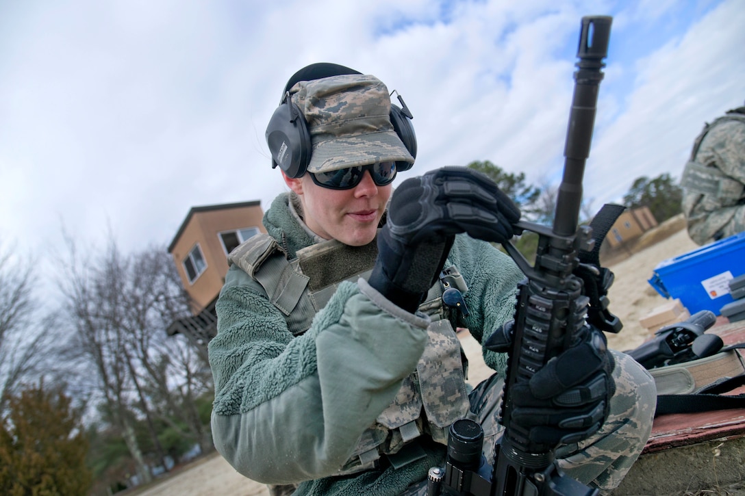 New Jersey Air National Guard Staff Sgt. Laura Lemay adjusts the front sight post on her M4 rifle during range qualification at Joint Base McGuire-Dix-Lakehurst, New Jersey, Feb. 26, 2017. Lemay is assigned to the 108th Security Forces Squadron. New Jersey Air National Guard photo by Staff Sgt. Ross A. Whitley