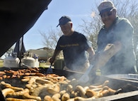 Crestview Military Affairs members cook up some brats for lunch prior to the kick off of the 919th Special Operations Wing’s annual Wing Day March 4 at Duke Field, Fla.  The wing sets aside a special day each year to show appreciation for its reservists and their family members. Events included music, food, children’s games, etc. (U.S. Air Force photo/Dan Neely)