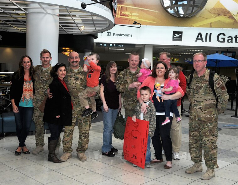 Family, friends and fellow 445th Airlift Wing Airmen welcome home four reservists from the 89th Airlift Squadron at the Dayton International Airport, Dayton, Ohio March 3, 2017. 
C-17 pilots Capts. Nathaniel Kirstein and Paul Kolk, and loadmasters Master Sgt. David White and Staff Sgt. Zachary Webb, were returning from a 45-day deployment in Southwest Asia, supporting Operation Inherent Resolve. While downrange, the crew flew more than 300 combat hours accomplishing 60 plus sorties. They moved more than one million pounds of cargo and passengers throughout the area of responsibility. (U.S. Air Force photo/ Tech. Sgt. Anthony Springer)

