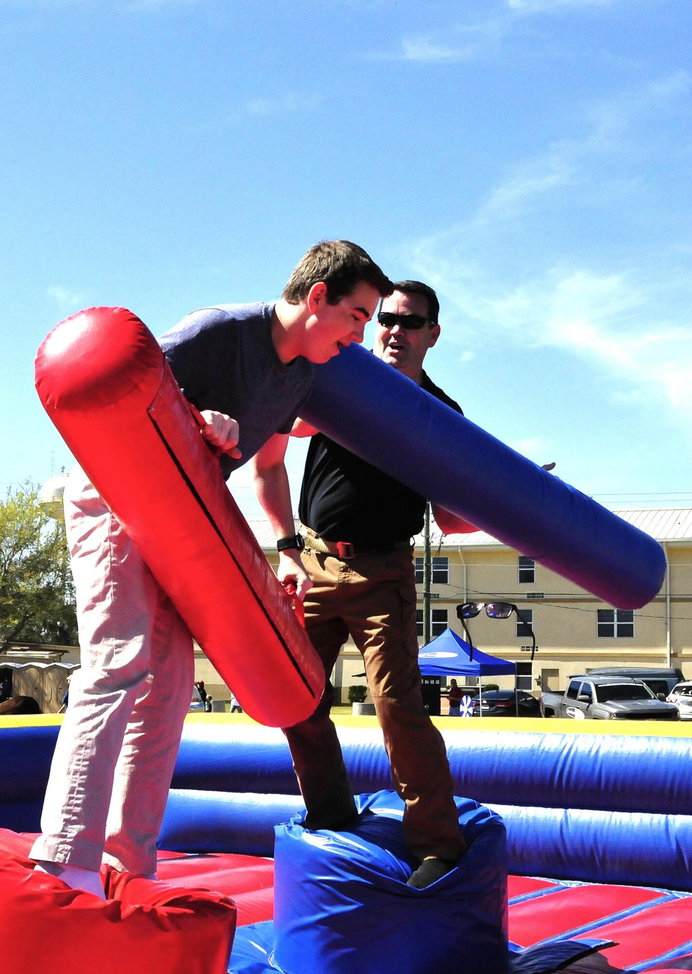 A father and son battle it out in the ring during the 919th Special Operations Wing’s annual Wing Day March 4 at Duke Field, Fla.  The wing sets aside a special day each year to show appreciation for its reservists and their family members. Events included music, food, children’s games, etc. (U.S. Air Force photo/Tech. Sgt. Kimberly Moore)