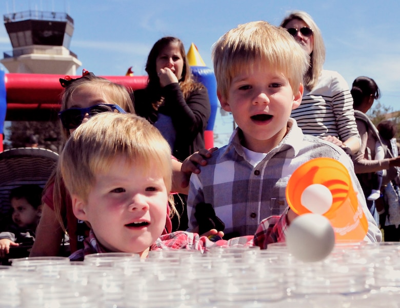 Little Airmen watch to see if their ping-pong ball makes it into a cup during the 919th Special Operations Wing’s annual Wing Day March 4 at Duke Field, Fla.  The wing sets aside a special day each year to show appreciation for its reservists and their family members. Events included music, food, children’s games, etc. (U.S. Air Force photo/Tech. Sgt. Kimberly Moore)