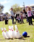A young bowler goes for a strike during the 919th Special Operations Wing’s annual Wing Day March 4 at Duke Field, Fla.  The wing sets aside a special day each year to show appreciation for its reservists and their family members. Events included music, food, children’s games, etc. (U.S. Air Force photo/Tech. Sgt. Kimberly Moore)