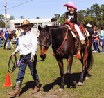 A cowgirl gets a ride around during the 919th Special Operations Wing’s annual Wing Day March 4 at Duke Field, Fla.  The wing sets aside a special day each year to show appreciation for its reservists and their family members. Events included music, food, children’s games, etc. (U.S. Air Force photo/Tech. Sgt. Kimberly Moore)