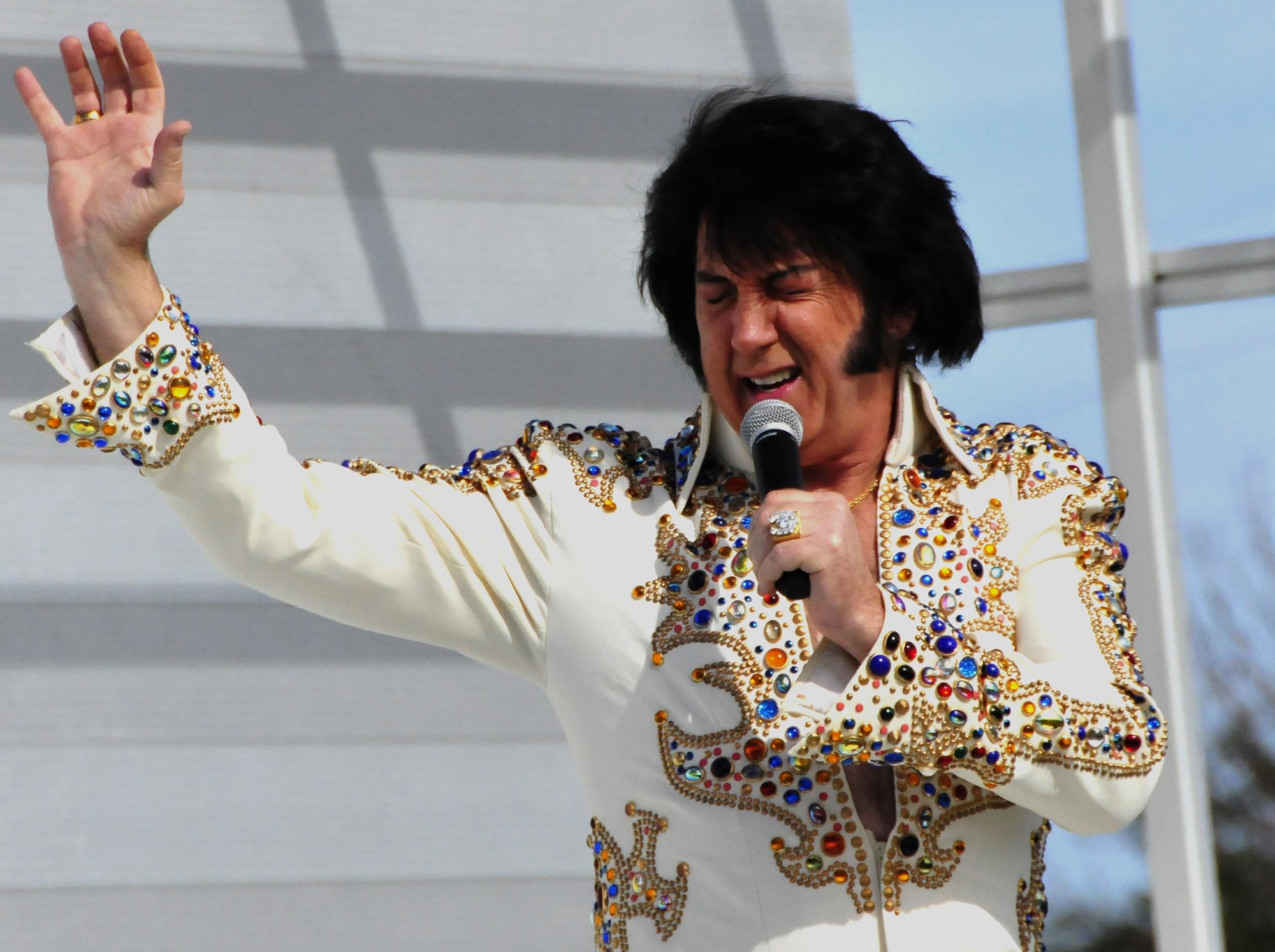 An Elvis impersonator belts out a tune during the 919th Special Operations Wing’s annual Wing Day March 4 at Duke Field, Fla.  The wing sets aside a special day each year to show appreciation for its reservists and their family members. Events included music, food, children’s games, etc.