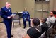 The commander of the 932nd Medical Group, Col. Leon Barringer, gives his congratulations to the family and friends of his newest promotee, Chief Master Sgt. Robert Cutchin, seated.  The colonel recognized the dedication and contributions of both the Airman and his family in a special promotion ceremony held March 5, 2017.  A packed room of fellow Airmen came out to witness the event on Scott Air Force Base, near Belleville, Illinois. Cutchin is the Superintendent of Health Services Management at the 932nd Medical Squadron, 932nd Medical Group.  The 932nd MDS trains and equips 188 medical personnel on the performance of duties associated with the Expeditionary Medical Support (EMEDS) mission. (U.S. Air Force photo by Lt. Col. Stan Paregien) 