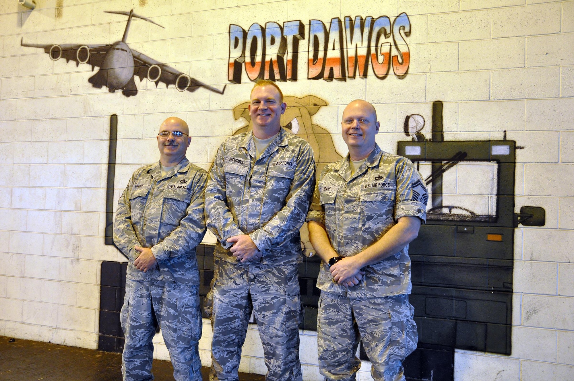 Senior Master Sgt. Paul Wright, Master Sgt. David Worrell and Senior Master Sgt. Steve Adams, all members of the 87th Aerial Port Squadron, have more than 50 years of service at the 445th Airlift Wing. These Airmen are retiring this year. (U.S. Air Force photo/Staff Sgt. Rachel Ingram)