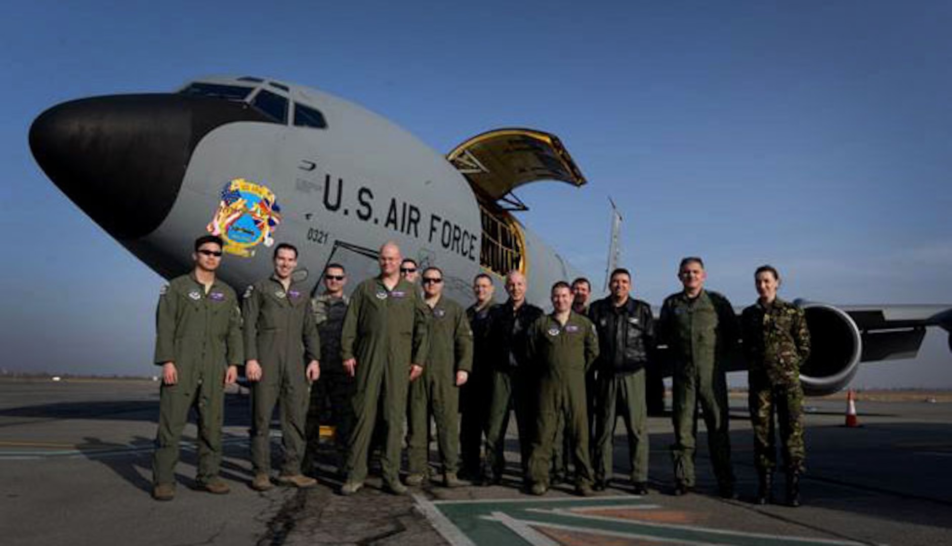 U.S. Air Force and Romanian air force Airmen pose for a photo after a flight Feb. 28, 2017, during air refueling training over Bucharest, Romania. The RoAF F-16 Fighting Falcons made their first contact with a U.S. tanker during the flight as part of air refueling training and certification conducted by the 100th Air Refueling Wing from RAF Mildenhall, England. (U.S. Air Force photo by Staff Sgt. Kate Thornton)