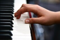 Airman 1st Class Yoli Alvarez Hernandez, 341st Medical Operations Squadron mental health technician, plays the piano at the base chapel Feb. 28, 2017, at Malmstrom Air Force Base, Mont. Alvarez Hernandez is a self-taught artist. (U.S. Air Force photo/Airman 1st Class Magen M. Reeves)