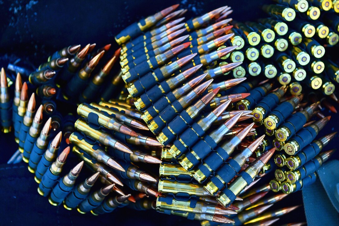 Linked 7.62 mm ammunition belts lay on the ground during live-fire machine gun training at Grezelka range, Joint Base Elmendorf-Richardson, Alaska, Feb. 28, 2017. Air Force photo by Justin Connaher