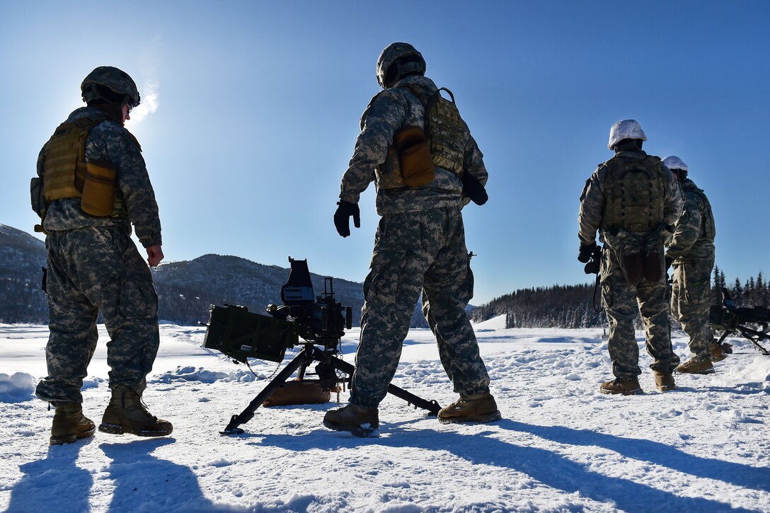 Soldiers prepare to fire the Mk 19 40mm grenade machine gun during live-fire machine gun training at Grezelka range, Joint Base Elmendorf-Richardson, Alaska, Feb. 28, 2017. Air Force photo by Justin Connaher