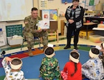 Sgt. 1st Class Daniel Cummings from the 264th Medical Battalion at Joint Base San Antonio-Fort Sam Houston reads Dr. Seuss books to students at East Terrell Hills Elementary School March 2.