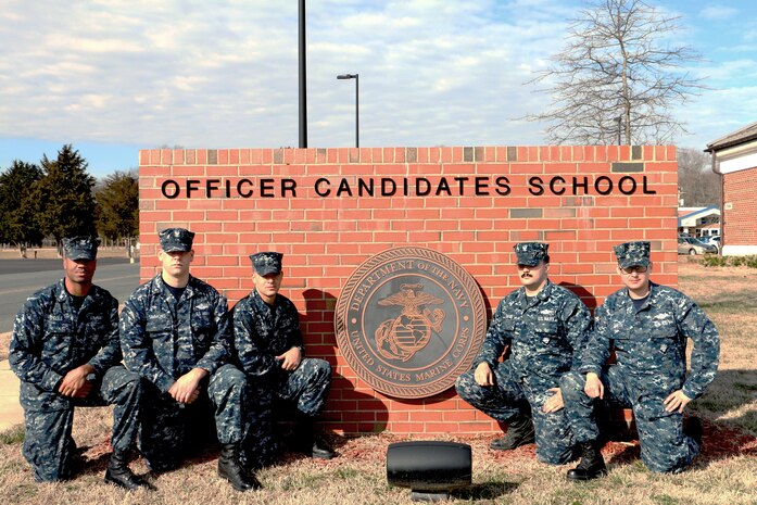 Five Corpsmen provided aid to a civilian employee at Quantico, Feb. 7, after the man slipped on the railroad tracks out near OCS. The photo is of Petty Officer 3rd Class Xavier Cole, Petty Officer 3rd Class Kenneth Simmons, Hospitalman Xavier Chatman, Petty Officer 3rd Class Jeremy Davis, Petty Officer 3rd Class David Smith kneeling in front of the Officer Candidate School.
