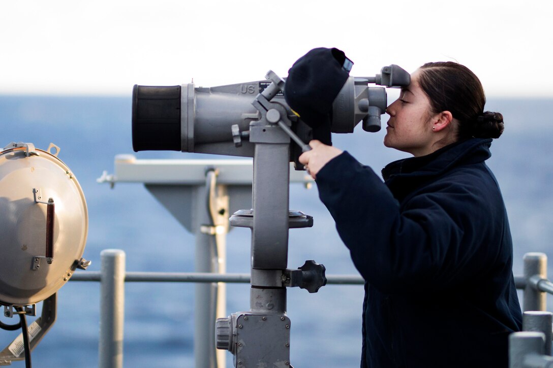 Navy Seaman Mary Jaramillo stands watch aboard the amphibious assault ship USS Bataan in the Atlantic Ocean, March 3, 2017. Navy photo by Petty Officer 2nd Class Nicholas Frank Cottone
