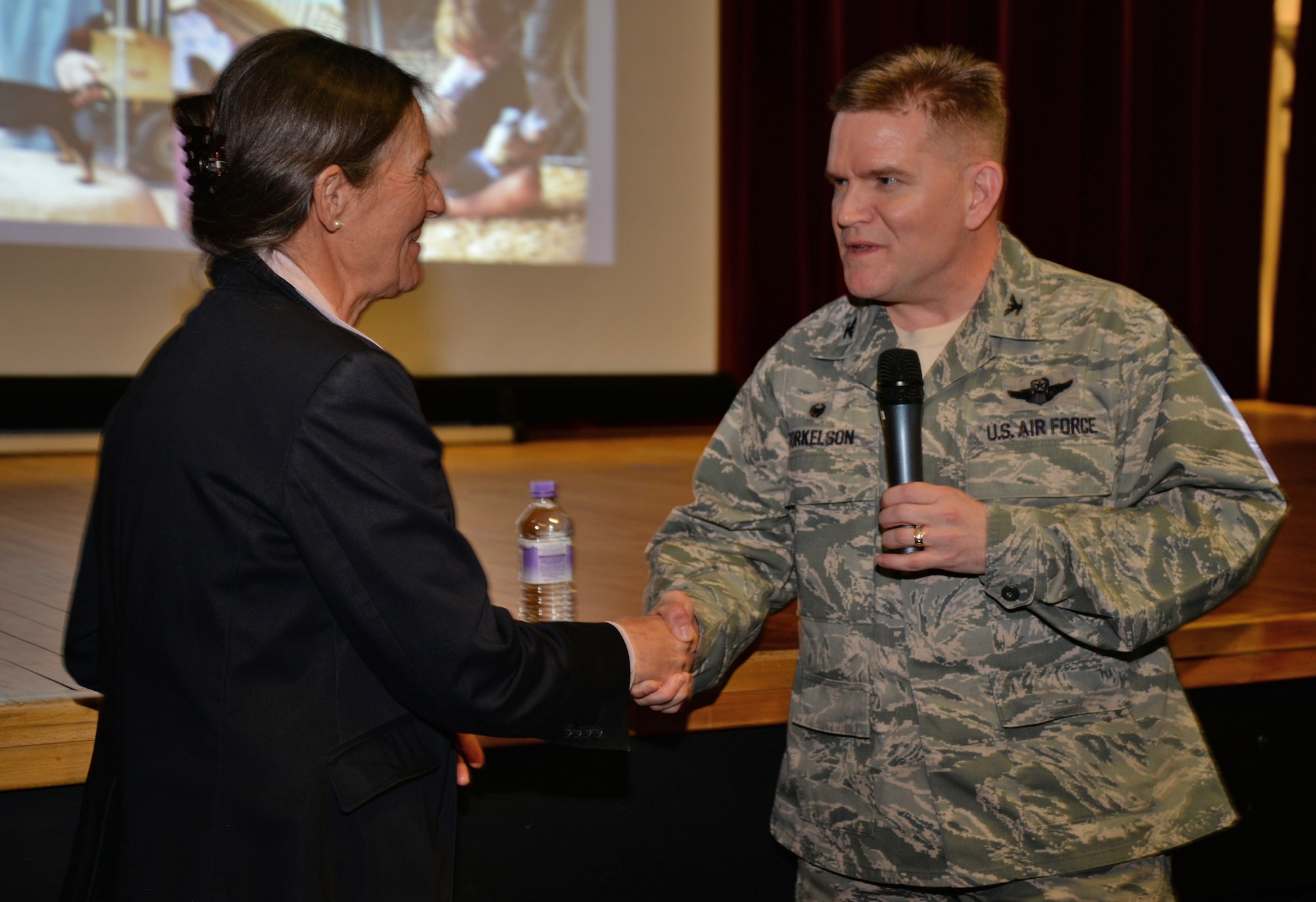 U.S. Air Force Col. Thomas D. Torkelson, right, 100th Air Refueling Wing commander thanks U.S. Army retired Brig. Gen. Rhonda Cornum for telling her story March 2, 2017, at the base theater on RAF Mildenhall, England. Cornum is the founder of the Comprehensive Soldier Fitness program which helps soldiers cope when a stressful situation occurs. (U.S. Air Force photo by Senior Airman Christine Halan)