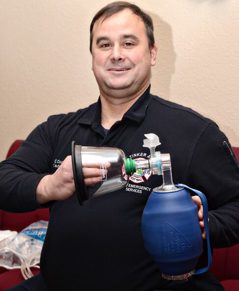 Lt. Chris Cooney, with Tinker Fire and Emergency Services, displays one of the new emergency oxygen kits specially designed for animals that his department has recently received from a California-based nonprofit called Air For Paws. The kits can help save the life of any animal on or around base in fire emergency situations. (Air Force photo by Kelly White)