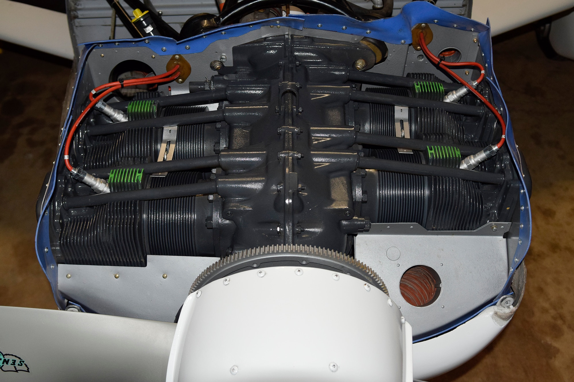 A Lycoming O-360 engine mounted on a Piper Cherokee shows the important characteristics of O-series engines: horizontally opposed cylinders on either side of the crank-shaft which turns the propeller (lower front).  Tinker maintained various engines of this type throughout the years as they were common for early Liasion, trainer and even drone aircraft. (U.S. Air Force photo/Greg L. Davis)