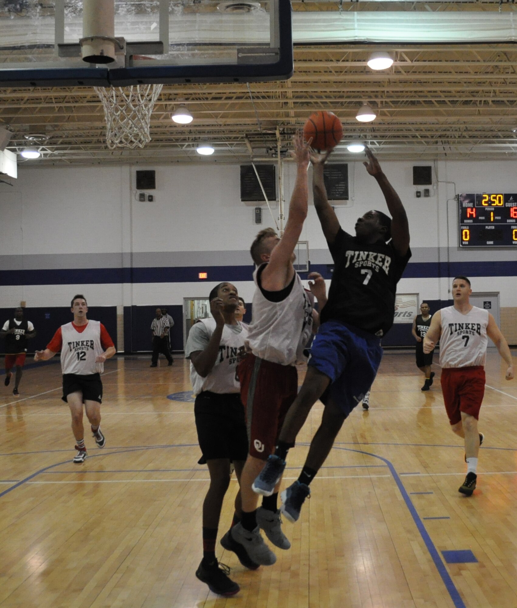 MXS 1’s Ja’Quan Williams, No. 7, shows his stuff Feb. 21 as his team clips MXS 2 by a score of 38-35 at the Gerrity Fitness Center. Playoffs begin next week for the 2016-2017 Tinker Intramural Basketball season. (Air Force photo by John Parker)