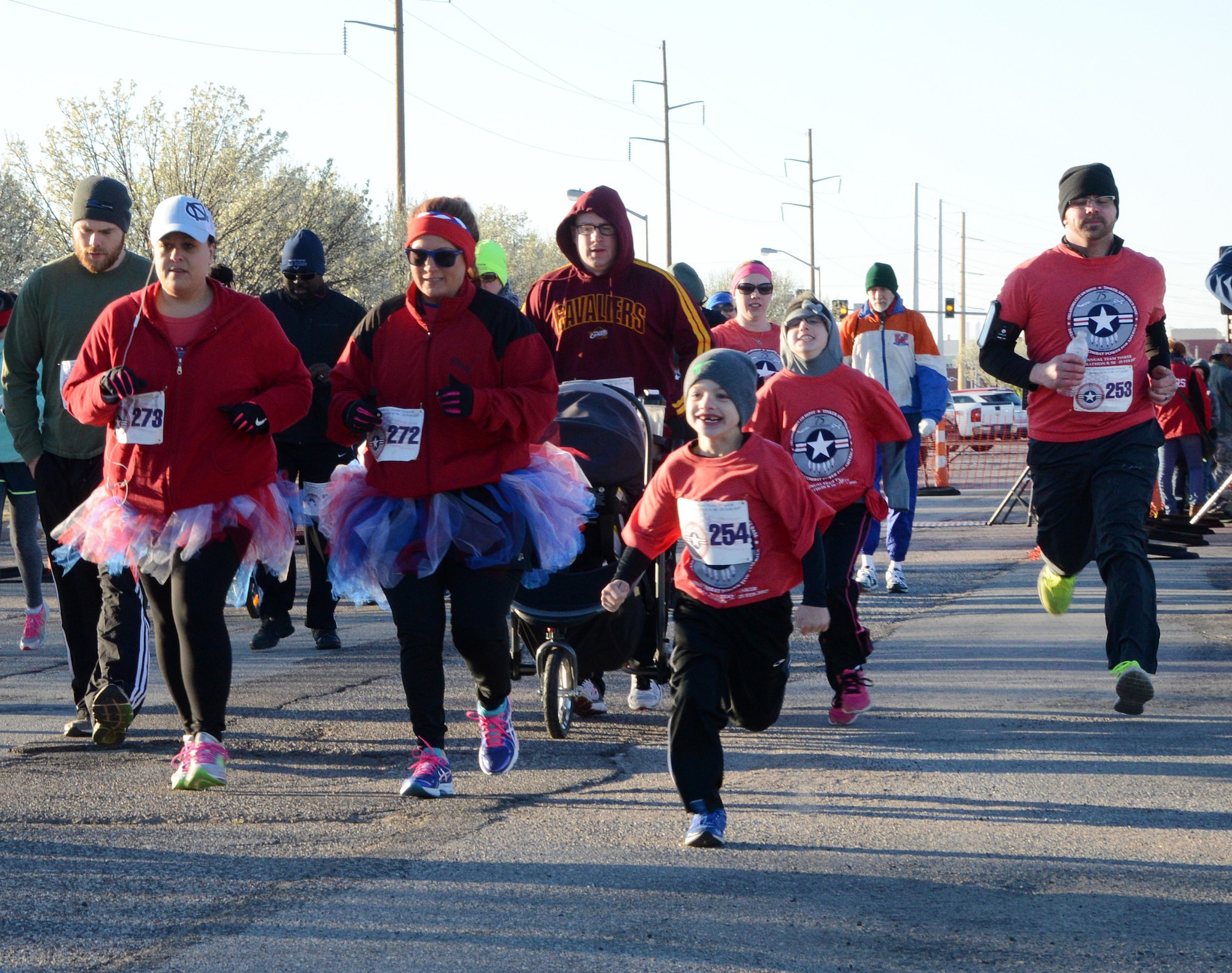People of all ages participated in Tinker’s 75th Anniversary Half Marathon and 5K Feb. 25. The Calvert family, all wearing their red event T-shirts, ran the 5K together. (Air Force photo by Kelly White)
