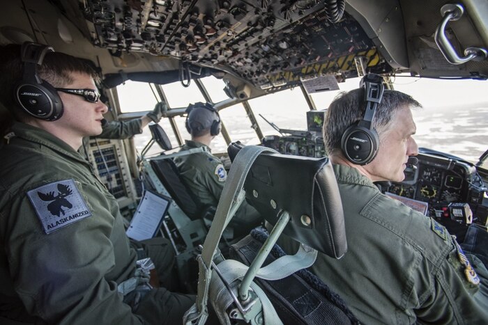 Crew members from the Alaska Air National Guard’s 144th Airlift Squadron, , along with Air Force Col. Steven deMilliano, right, the 176th Wing commander, fly a C-130 Hercules aircraft on the unit’s final flight with the C-130s at Joint Base Elmendorf-Richardson, Alaska, March 4, 2017. After 41 years of flying the C-130 aircraft, the 144th Airlift Squadron’s eight C-130s were divested, with the planes either being transferred to outside units or retired from service. The unit’s last two aircraft departed Joint Base Elmendorf-Richardson the following day. Air National Guard photo by Staff Sgt. Edward Eagerton