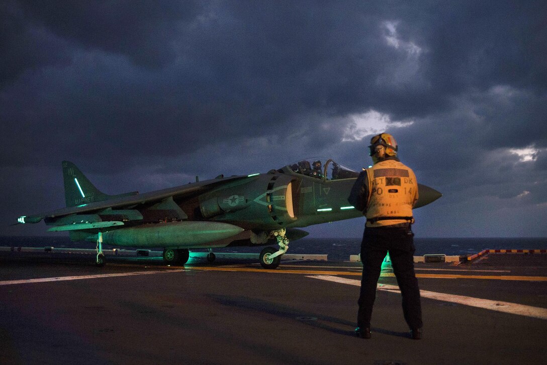 A Marine Corps AV-8B Harrier II taxies on the flight deck of the amphibious assault ship USS Bonhomme Richard during night operations in the Philippine Sea, March 2, 2017. Navy photo by Petty Officer 2nd Class Diana Quinlan