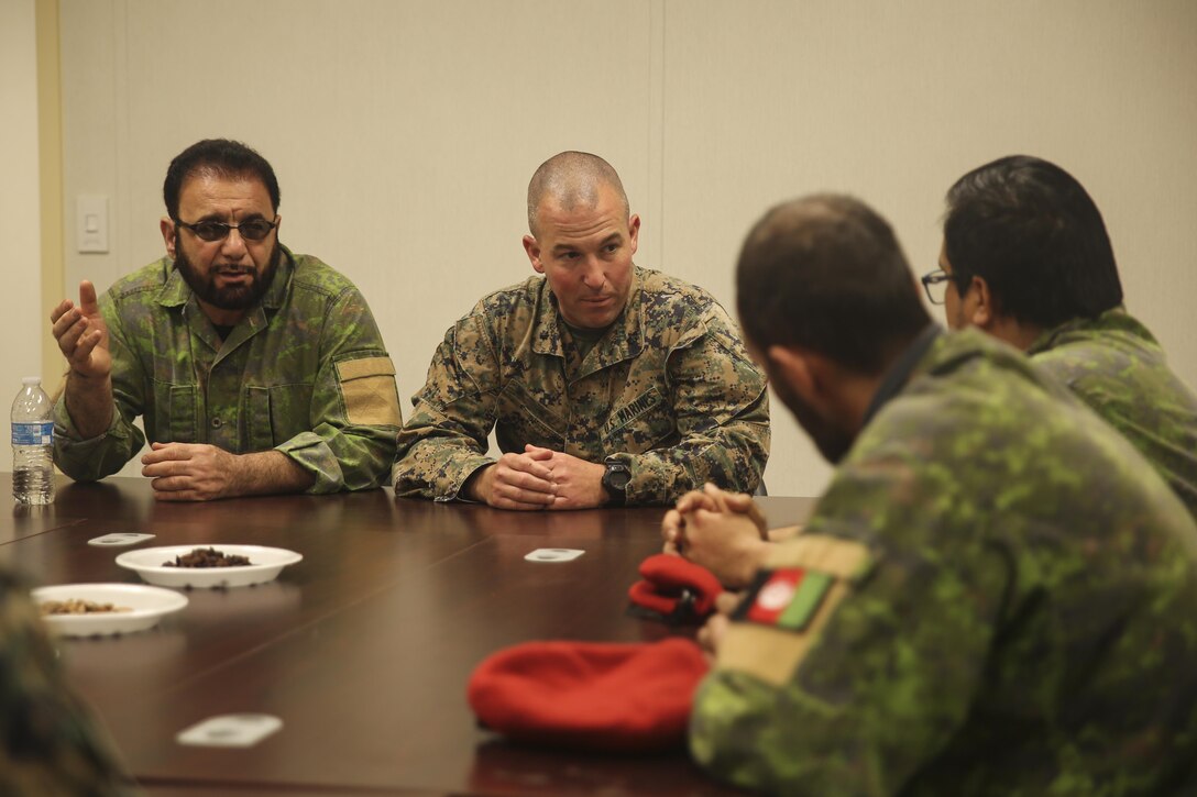 A Marine with Task Force Southwest speaks to Afghan role players during a full mission rehearsal at Camp Lejeune, N.C., Feb. 28, 2017. During the week-long exercise, Marines with the unit enhanced their advisory and combat skills in preparation for an upcoming deployment to Helmand Province, Afghanistan. Task Force Southwest is comprised of approximately 300 Marines, whose mission will be to train, advise and assist the Afghan National Army 215th Corps and 505th Zone National Police. (U.S. Marine Corps photo by Sgt. Lucas Hopkins)
