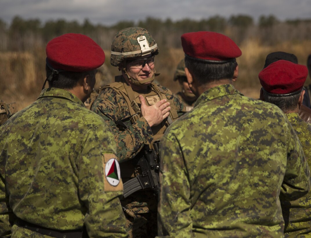 Brig. Gen. Roger Turner, commanding general of Task Force Southwest, greets an Afghan role player before a key leader engagement during the full mission rehearsal at forward operating base Bravo, Camp Lejeune, N.C., Feb. 28, 2017. The Marines worked with Afghan role players to gain better cultural understanding before deploying later this year to Helmand Province, Afghanistan. Task Force Southwest is comprised of approximately 300 Marines whose mission will be to train, advise and assist the Afghan National Army 215th Corps and the 505th Zone National Police. (U.S. Marine Corps photo by Sgt. Justin T. Updegraff)