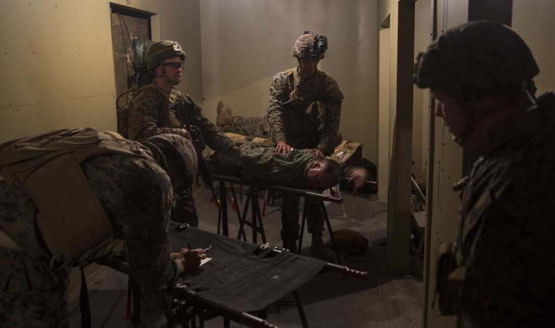 Marines with Task Force Southwest calm a notional casualty during a mass casualty drill during the full mission rehearsal at forward operating base Bravo, Camp Lejeune, N.C., Feb. 28, 2017. The Marines are scheduled to deploy later this year as part of the task force to train, advise and assist the Afghan National Army 215th Corps and 505th Zone National Police in Helmand Province, Afghanistan. (U.S. Marine Corps photo by Sgt. Justin T. Updegraff)