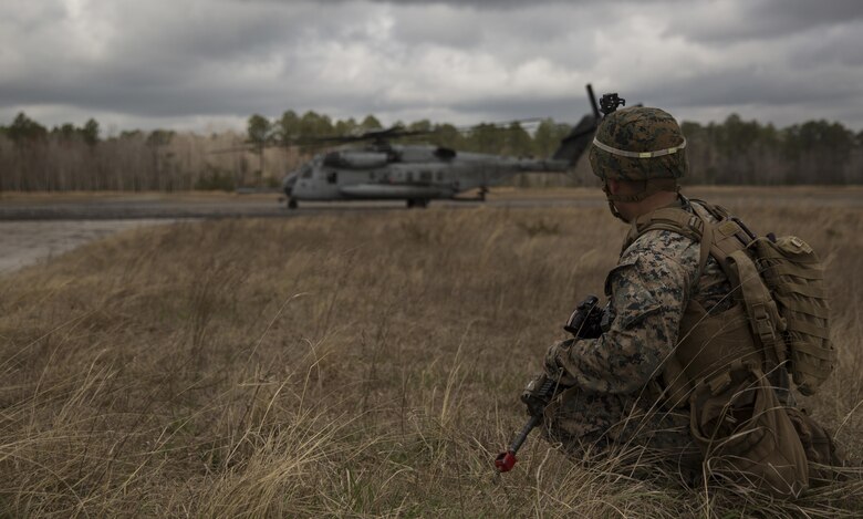 A Marine with Task Force Southwest provides security for a CH-53 super stallion during the full mission rehearsal at forward operating base Bravo, Camp Lejeune, N.C., Feb. 28, 2017. The Marines are scheduled to deploy as part of the task force to train, advise and assist the Afghan National Army 215th Corps and 505th Zone National Police. (U.S. Marine Corps photo by Sgt. Justin T. Updegraff)