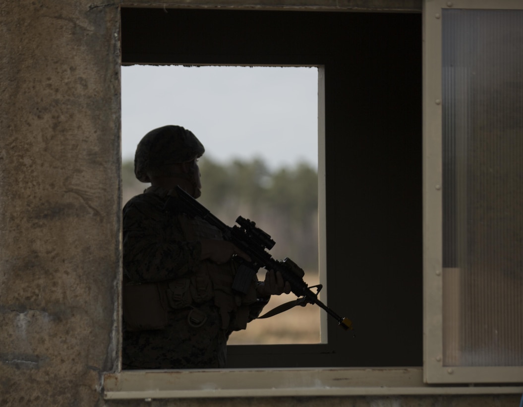 A Marine with Task Force Southwest scans the area for an enemy threat after receiving notional indirect fire during the full mission rehearsal at forward operating base Bravo, Camp Lejeune, N.C., Feb. 28, 2017. The Marines are scheduled to deploy as part of the task force to train, advise and assist the Afghan National Army 215th Corps and 505th Zone National Police. (U.S. Marine Corps photo by Sgt. Justin T. Updegraff)