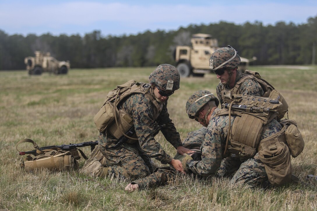 Marines with Task Force Southwest tend to a simulated casualty during a Tactical Recovery of Aircraft and Personnel training scenario at Camp Lejeune, N.C., March 2, 2017. The week-long rehearsal consisted of advisory meetings with Afghan role players, medical drills and combat scenarios, preparing the unit for an upcoming deployment to Helmand Province, Afghanistan. Task Force Southwest is comprised of approximately 300 Marines, whose mission will be to train, advise and assist the Afghan National Army 215th Corps and 505th Zone National Police. (U.S. Marine Corps photo by Sgt. Lucas Hopkins)