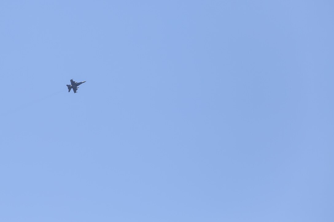 An F/A-18 Hornet flies over Camp Lejeune, N.C. during a full mission rehearsal March 3, 2017. Approximately 300 Marines with Task Force Southwest participated in the week-long exercise, which consisted of live-fire ranges, medical drills and advisory meetings with Afghan role players. Marines with Tthe unit are scheduled to deploy to Helmand Province, Afghanistan in the Spring, where they will train, advise and assist the Afghan National Army 215th Corps and 505th Zone National Police. (U.S. Marine Corps photo by Sgt. Lucas Hopkins)