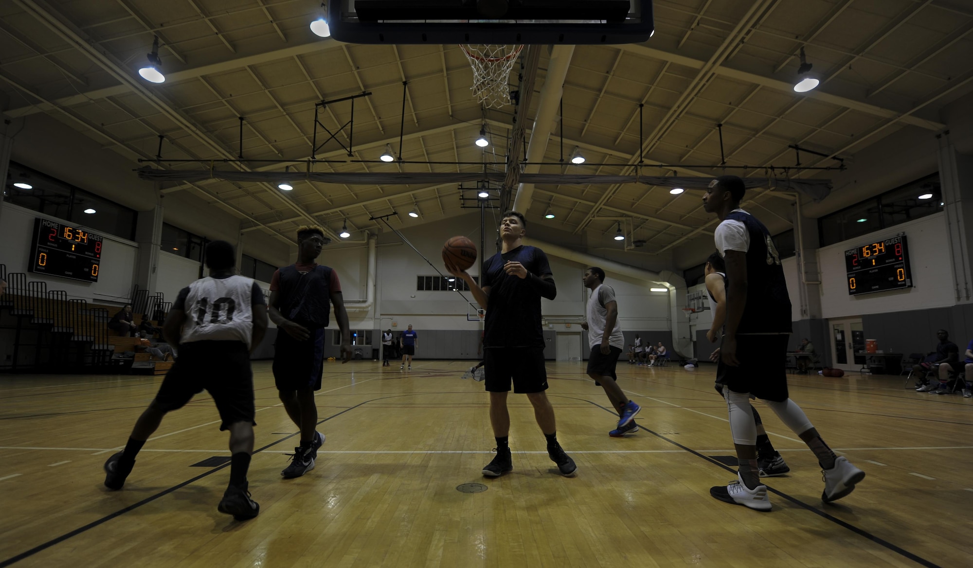 The 1st Special Operations Maintenance Squadron competes against the 1st Special Operations Contracting Squadron during an intramural basketball game at Hurlburt Field, Fla., March 2, 2017. The game consisted of two, 15-minute halves that ended with a win for the 1st SOCONS. (U.S. Air Force photo by Airman 1st Class Dennis Spain)