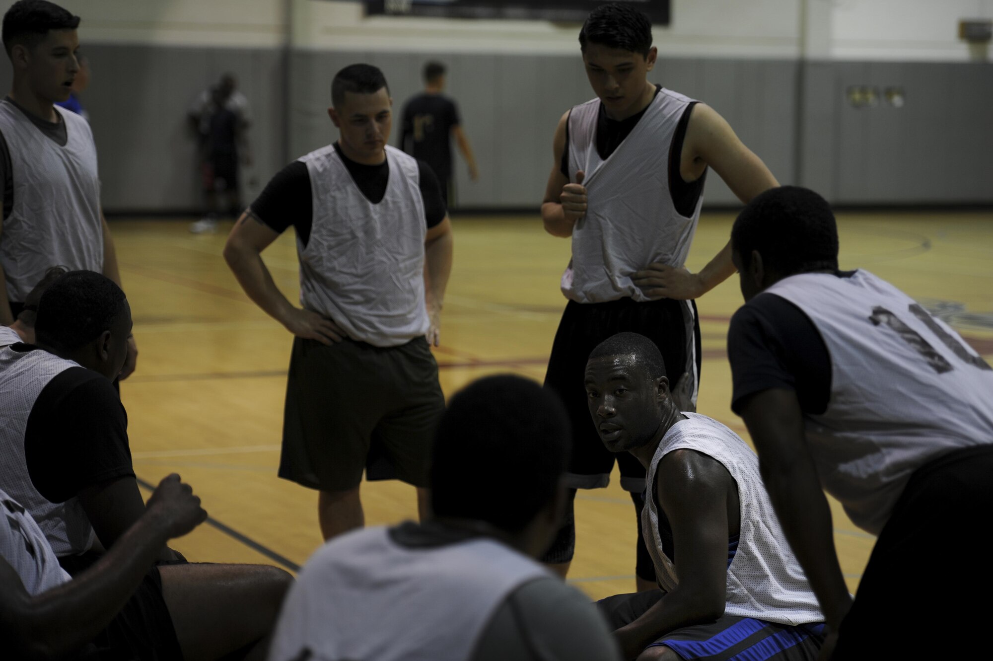 The 1st Special Operations Maintenance Squadron intramural basketball team huddle to discuss a gameplay strategy at Hurlburt Field, Fla., March 2, 2017. The 1st SOMXS competed in a mid-season game against the 1st Special Operations Contracting Squadron, with a record of five wins and five losses. (U.S. Air Force photo by Airman 1st Class Dennis Spain)