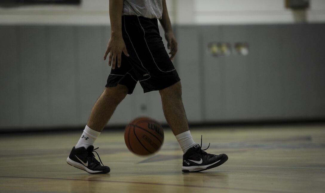 The 1st Special Operations Maintenance Contracting Squadrons compete against each other in a mid-season intramural basketball game at Hurlburt Field, Fla., March 3, 2017. The 1st SOCONS defeated the 1st SOMXS 78-62 making their season record three wins and five losses. (U.S. Air Force photo by Airman 1st Class Dennis Spain)