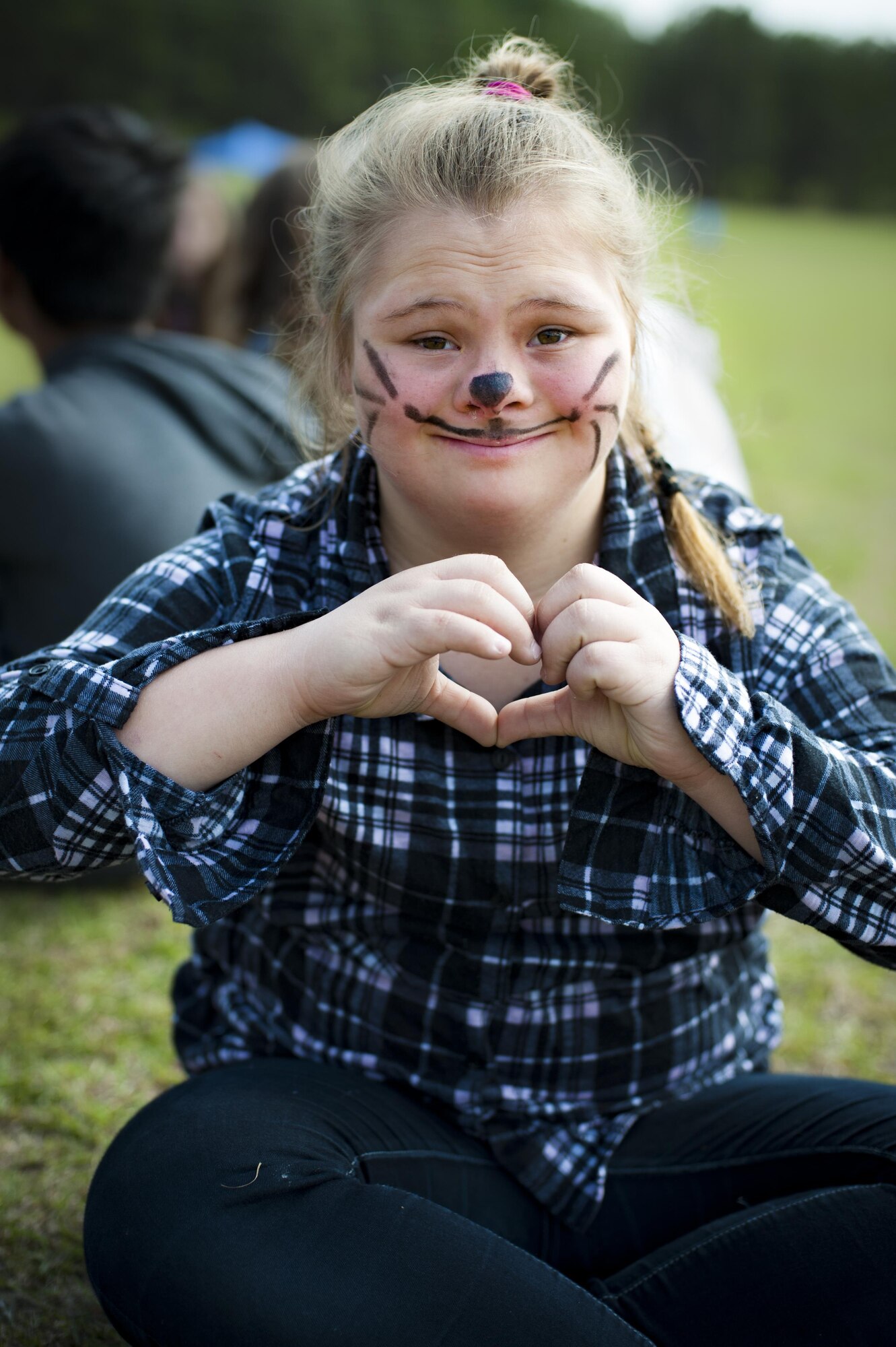 Hayley Dorminey, student at Lowndes Middle School, poses for a photo after having her face painted during the annual Special Olympics, March 2, 2017, at Freedom Park in Valdosta, Ga. More than 80 Moody Air Force Base Airmen volunteered at the event, allowing more than 250 children from five surrounding counties to compete in more than 10 Olympic activities. (U.S. Air Force photo by Airman 1st Class Lauren M. Sprunk)