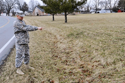 Sgt. First Class Chris Meinhardt, an 18-year veteran of the Ohio Army National Guard, shows where he saw a young boy walking alongside Black Road in Butler County while on his way to work the morning of October 20, 2016. Meinhardt, the senior human resources sergeant for Headquarters and Headquarters Battery, 1st Battalion, 174th Air Defense Artillery Regiment, stopped to help the child who had walked out of his grandmother’s house and wandered down the road.