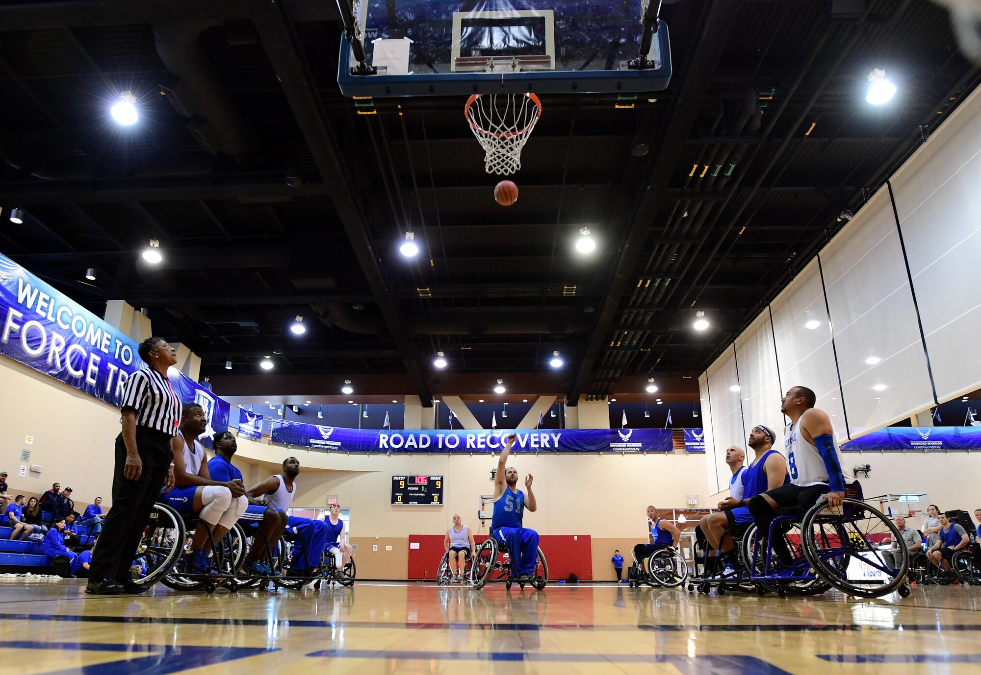 Air Force Wounded Warrior Trials competitors participate in the wheelchair basketball competition March 1, 2017, at Nellis Air Force Base, Nev. AFW2 focuses on specific personal and family needs and includes programs that cover a gamut of situations throughout the recovery process and beyond. (U.S. Air Force photo by Senior Airman Christian Clausen)