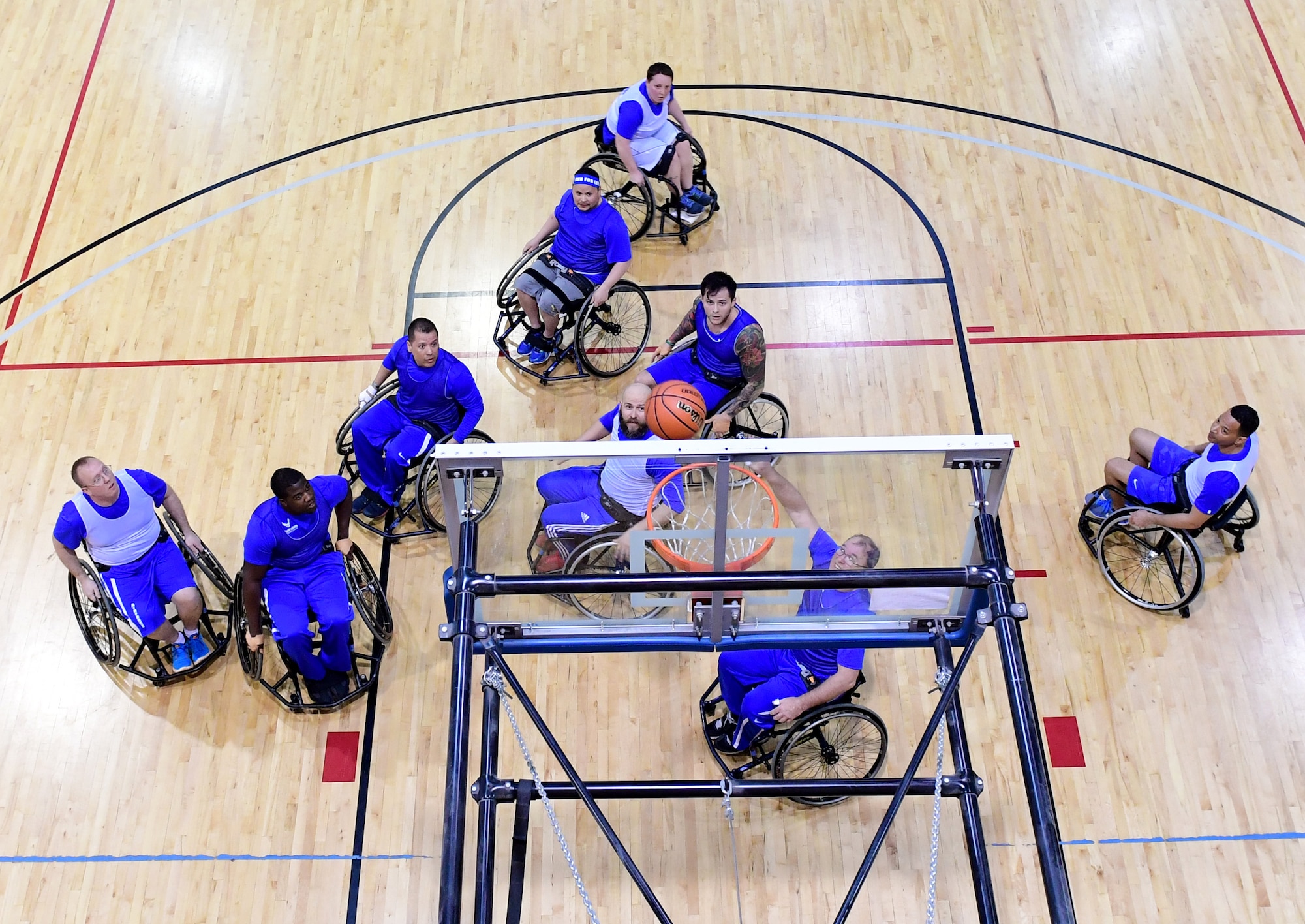 Air Force Wounded Warrior Trials competitors participate in the wheelchair basketball competition March 1, 2017, at Nellis Air Force Base, Nev. The competitors also competed in events such as rifle shooting, archery, track and field, and more to inspire espirit de corps and camaraderie among fellow wounded warriors. (U.S. Air Force photo by Senior Airman Christian Clausen)