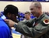 Col. David, 432nd Wing/432 Air Expeditionary Wing vice commander presents a medal to an Air Force Wounded Warrior Trials competitor after competing in the wheelchair basketball competition March 1, 2017, at Nellis Air Force Base, Nev. Competitors participated in the basketball tournament until a third, second and first place team were awarded. The trials allow wounded warriors to compete in sports again. (U.S. Air Force photo by Senior Airman Christian Clausen)