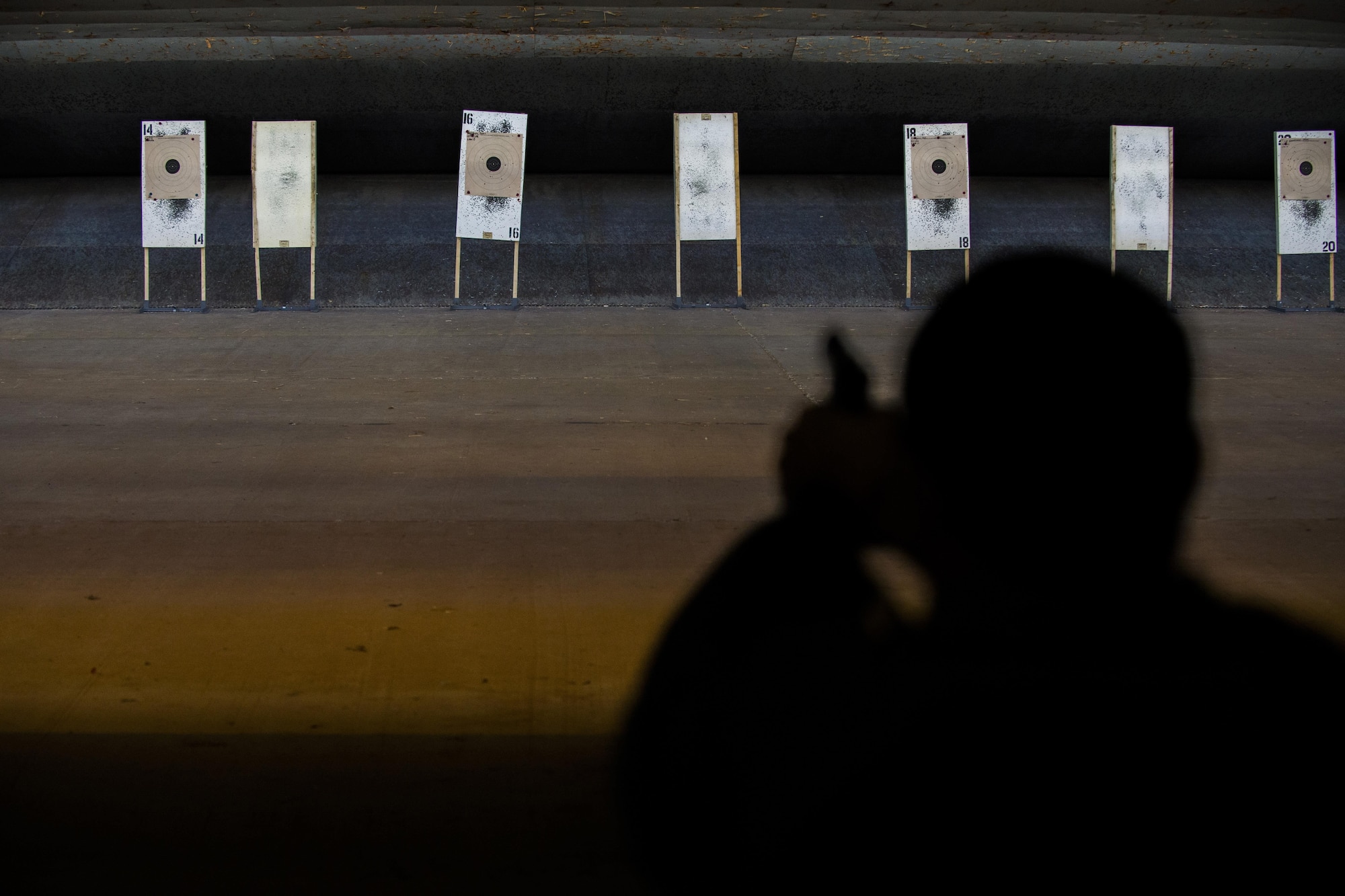 Master Sgt. Dennis Henry, 27th Special Operations Wing Public Affairs superintendent, fires his weapon at a target while competing in the Pistol Excellence in Competition March 2, 2017, at Cannon Air Force Base, N.M. Competitors shot a total of 30 rounds at a target 25 yards away during three different timed rounds. (U.S. Air Force photo by Senior Airman Luke Kitterman/Released)

