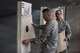 Two competitors collect their score sheets after participating in the Pistol Excellence in Competition March 2, 2017, at Cannon Air Force Base, N.M. Competitors who scored in the top 10 percentile received the Pistol EIC badge. (U.S. Air Force photo by Senior Airman Luke Kitterman/Released)     