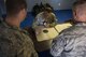 Tech. Sgt. Richard Kuster, 27th Special Operations Security Forces Squadron flight chief, tallies up points on a score sheet after competitors shot for the Pistol Excellence in Competition March 2, 2017, at Cannon Air Force Base, N.M. More than 50 competitors participated in the competition which lasted three days. (U.S. Air Force photo by Senior Airman Luke Kitterman/Released)