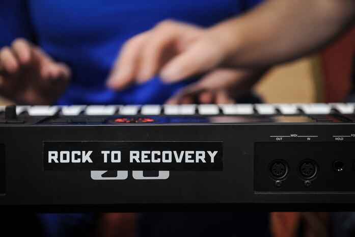 Air Force Wounded Warrior Trials participants play the keyboard during a Rock to Recovery practice session in Las Vegas, March 1, 2015. Geer founded Rock to Recovery in 2012 and took the program to rehab centers, mental health clinics and facilities for at-risk youth, before taking the program to the AFW2 Trials in 2015. (U.S. Air Force photo by Staff Sgt. Siuta B. Ika)