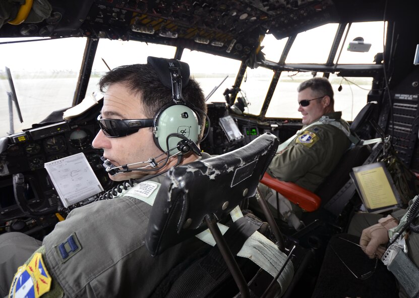 Capt. Daniel Morgese. left, and Lt. Col. John Lowe, HC-130P/N pilots with the 39th Rescue Squadron, run through their pre-flight checklists before taking King 52, the first HC-130 configured for Air Force rescue in 1964, for its final flight from Patrick Air Force Base, Florida, to Davis-Monthan, Arizona, March 6, 2017. (U.S. Air Force/Maj. Cathleen Snow)