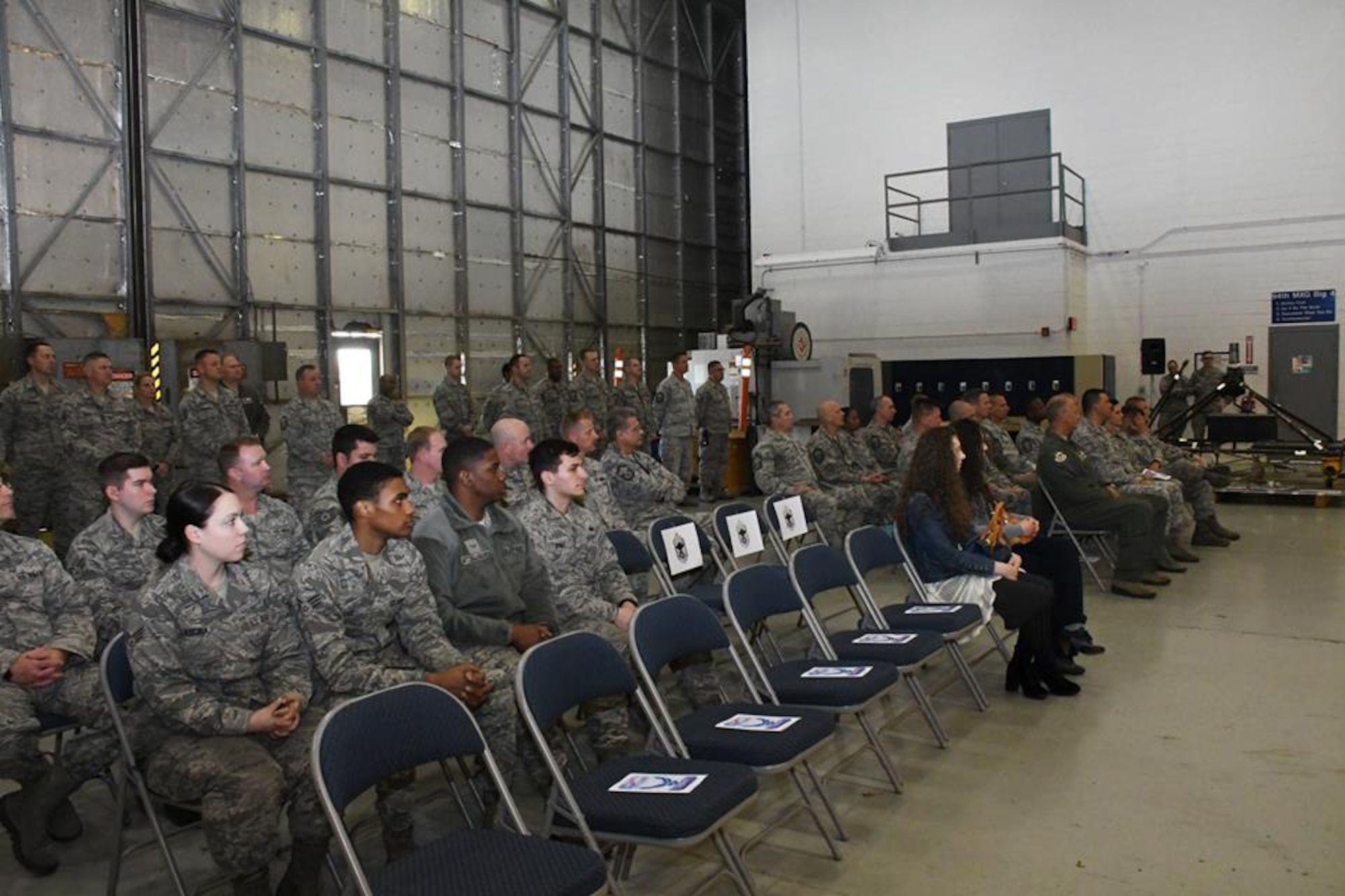 The attendees of Chief Master Sgt. Glen F. Saunders Jr., quality assurance superintendent with the 94th Maintenance Group promotion ceremony. They listen intently as Saunders gives remarks to civilian and military members March, 5, 2017 at Dobbins Air Reserve Base, Georgia. (U.S. Air Force photo/Airman 1st Class Justin Clayvon) 