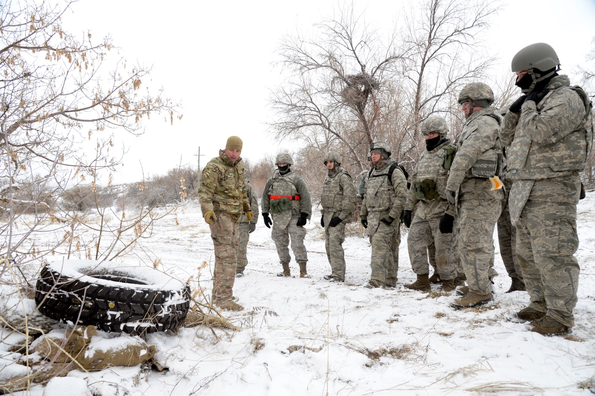 Staff Sgt. Jonathan Woods, 775th Civil Engineer Squadron, briefs 729th Air Control Squadron Airmen on Improvised Explosive Devices, or IEDs, during an expeditionary training exercise at the ‘North 40’ training area at Hill Air Force Base, Feb. 23. (U.S. Air Force photo by Todd Cromar)