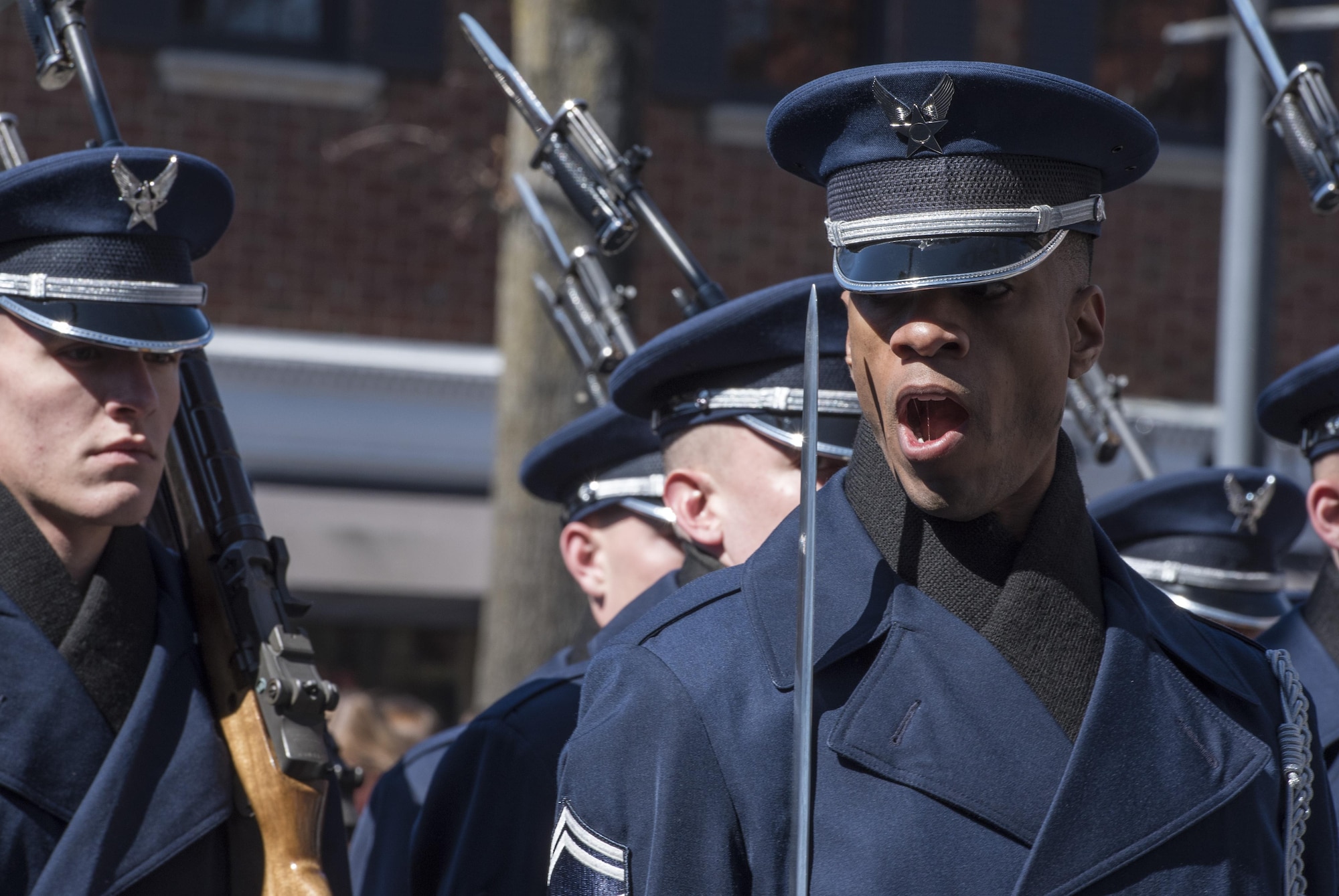 Senior Master Sgt. Robert Jones, U.S. Air Force Honor Guard operations superintendent, shouts a command during the 2017 Saint Patrick’s Day Parade in Alexandria, Va., March 4, 2017. In order to precisely follow these commands, ceremonial guardsmen go through an eight-week training program that teaches drill, discipline and standards. (U.S. Air Force photo by Senior Airman Jordyn Fetter)
